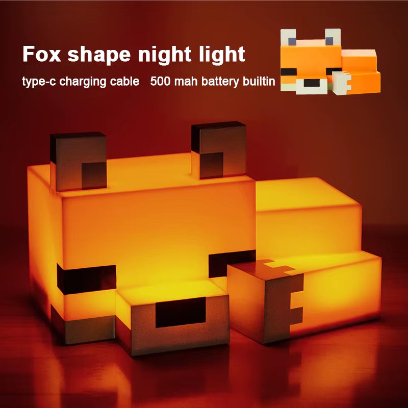 Pixel fox lamp glowing warm orange on a nightstand