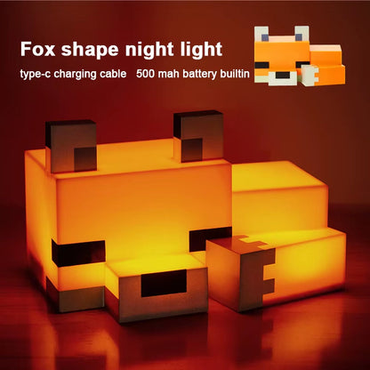 Pixel fox lamp glowing warm orange on a nightstand
