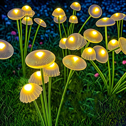 Solar mushroom garden lights glowing in the yard