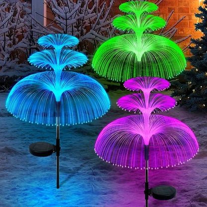 Solar jellyfish garden lights glowing on a pathway