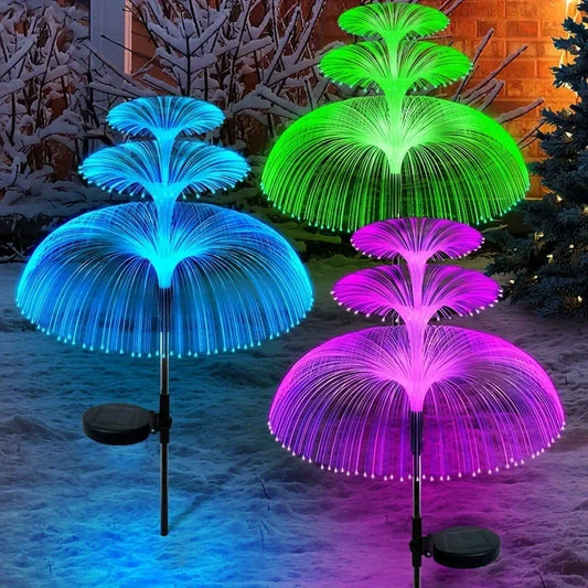 Solar jellyfish garden lights glowing on a pathway