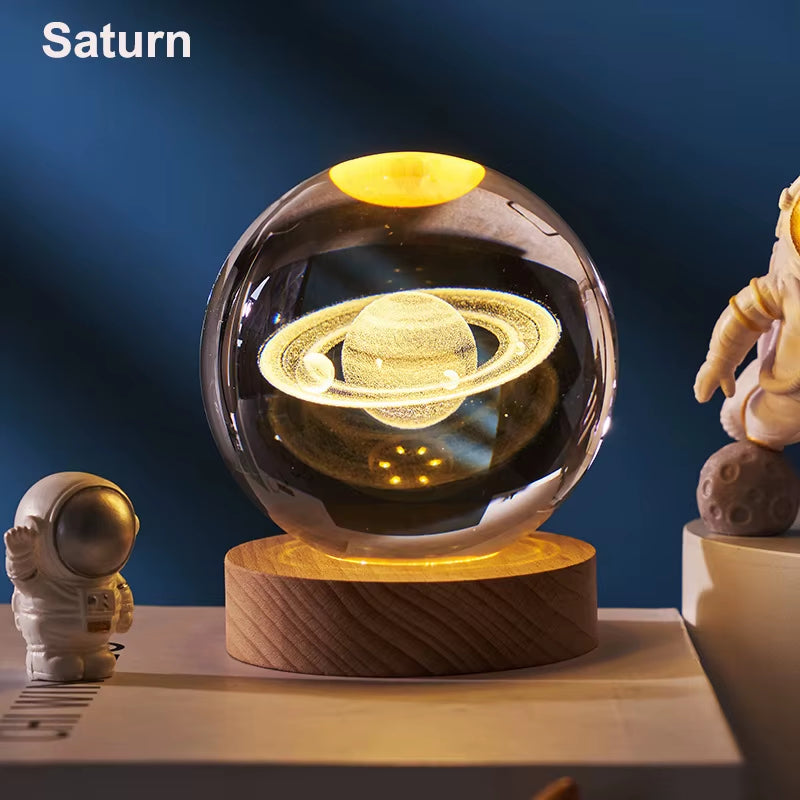 3D crystal ball night light glowing in a dark room