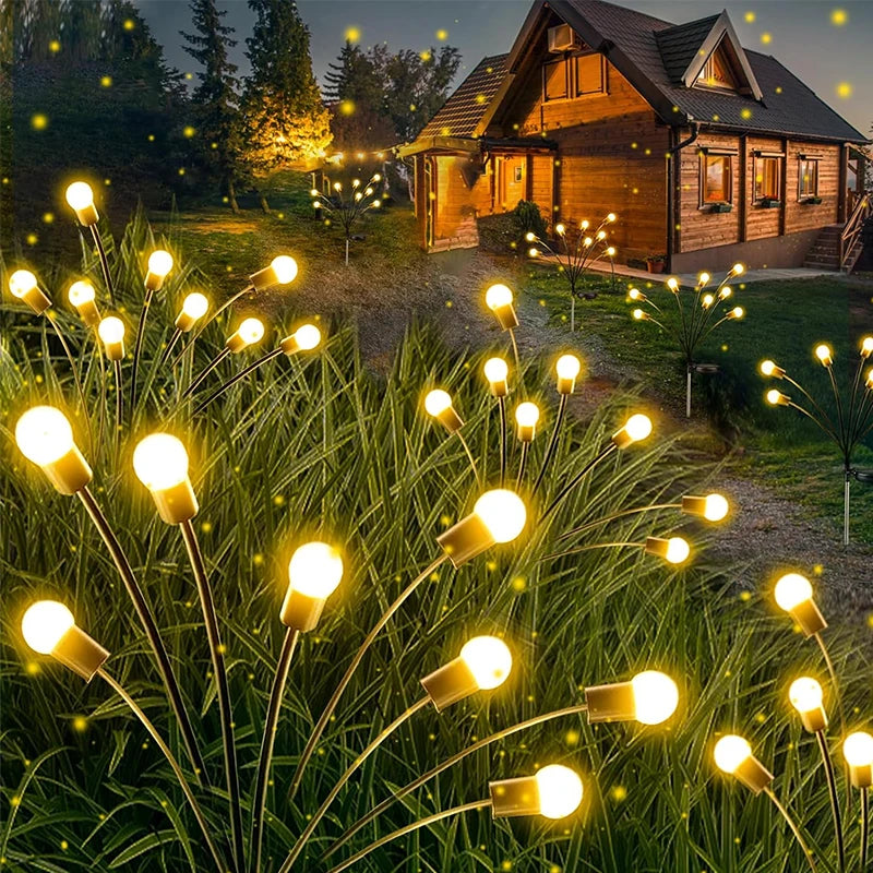 Solar firefly lights on flexible branches in a garden