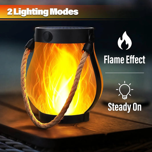 Hanging solar flame lantern glowing on a patio