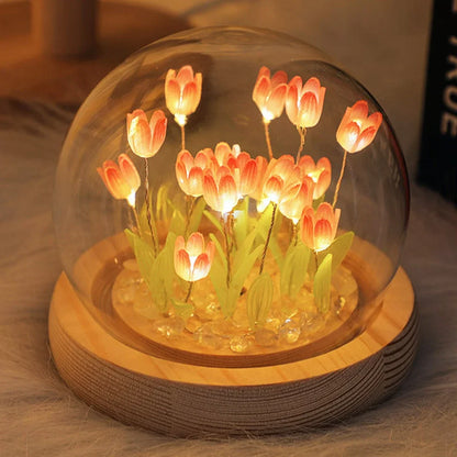 Pink DIY tulip night light glowing on a desk