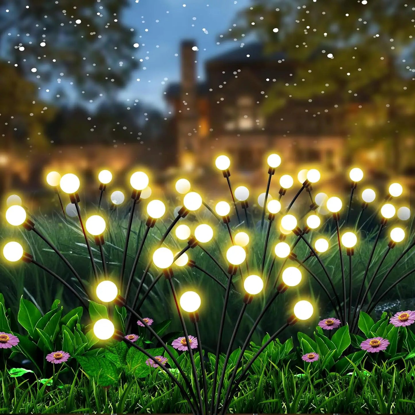 Solar firefly garden lights glowing at night